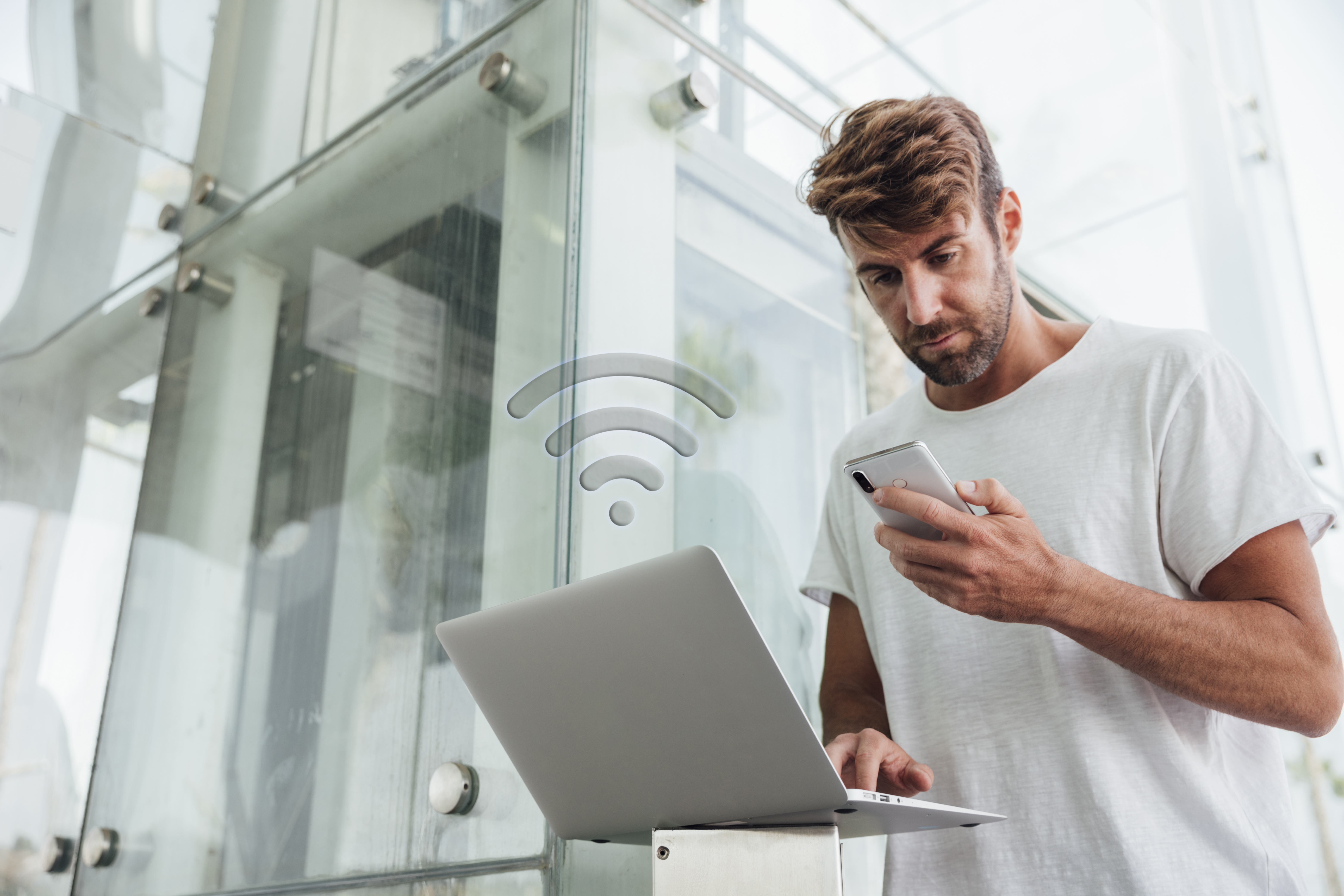 bearded-man-checking-portable-devices