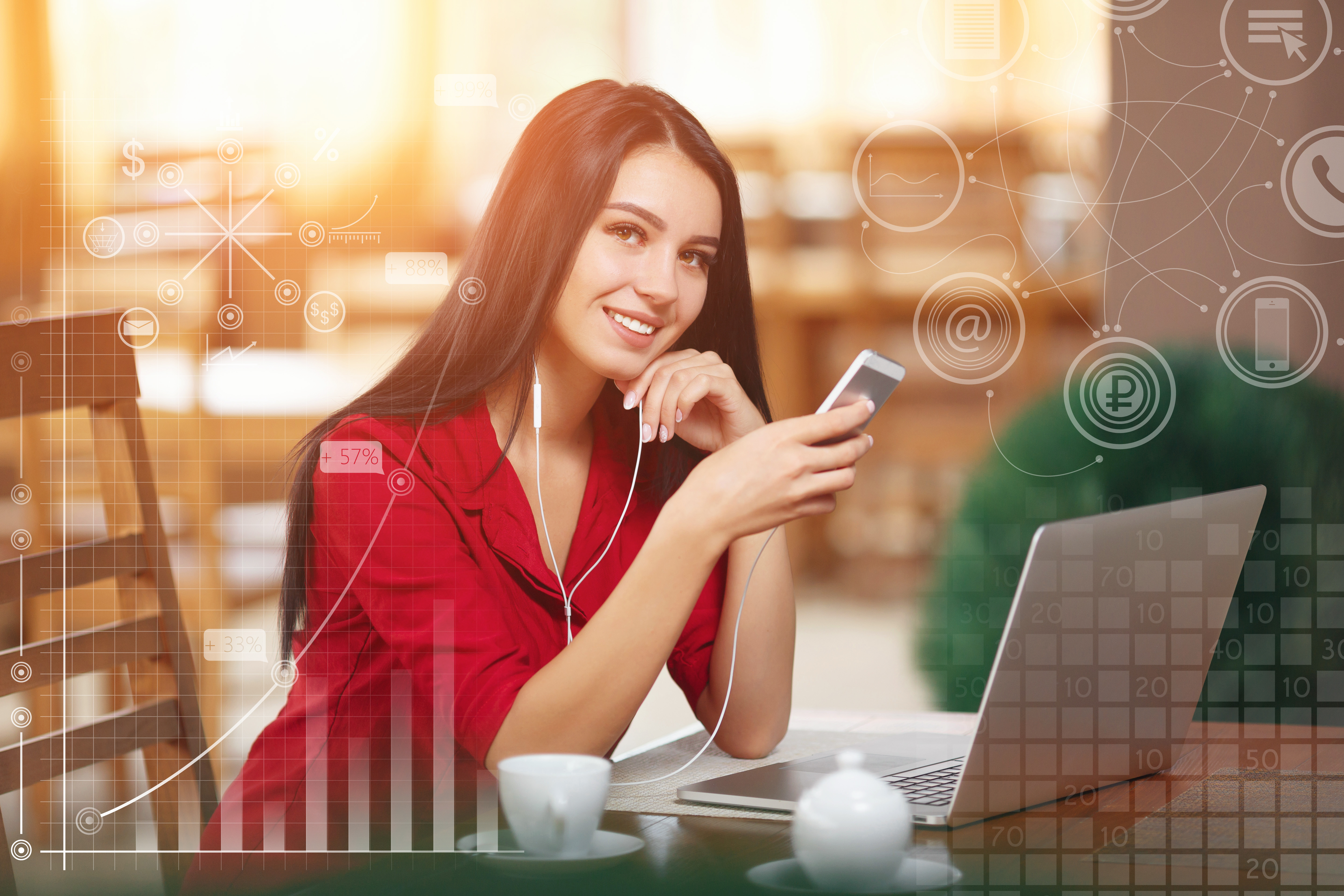 Young businesswoman using phone in coffee shop